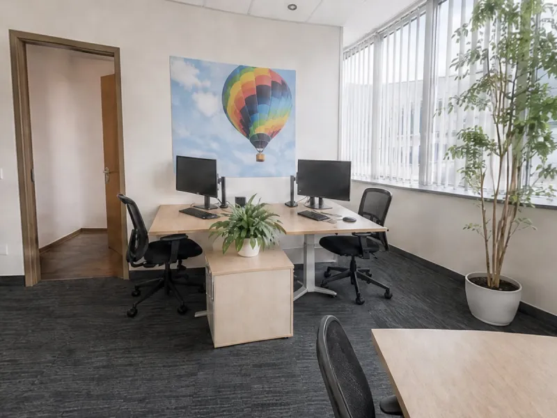 An open office rebuilt as a 360° escape room scene from phone photos